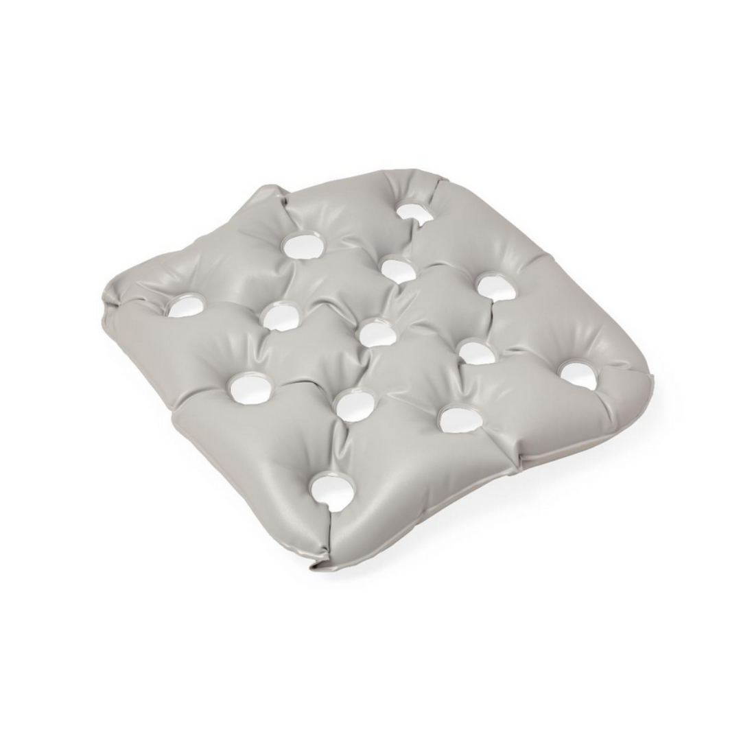 The Medline Pre-Inflated Bubble Cushion is a light gray, square inflatable wheelchair cushion with evenly spaced circular holes and static air technology for pressure relief, shown on a white background.
